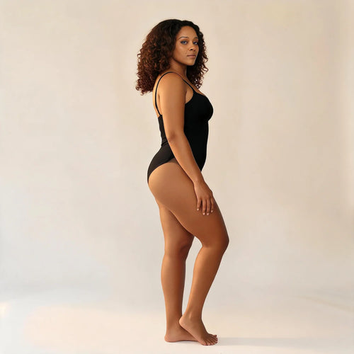 Body gainant ventre plat noir, vue de profil